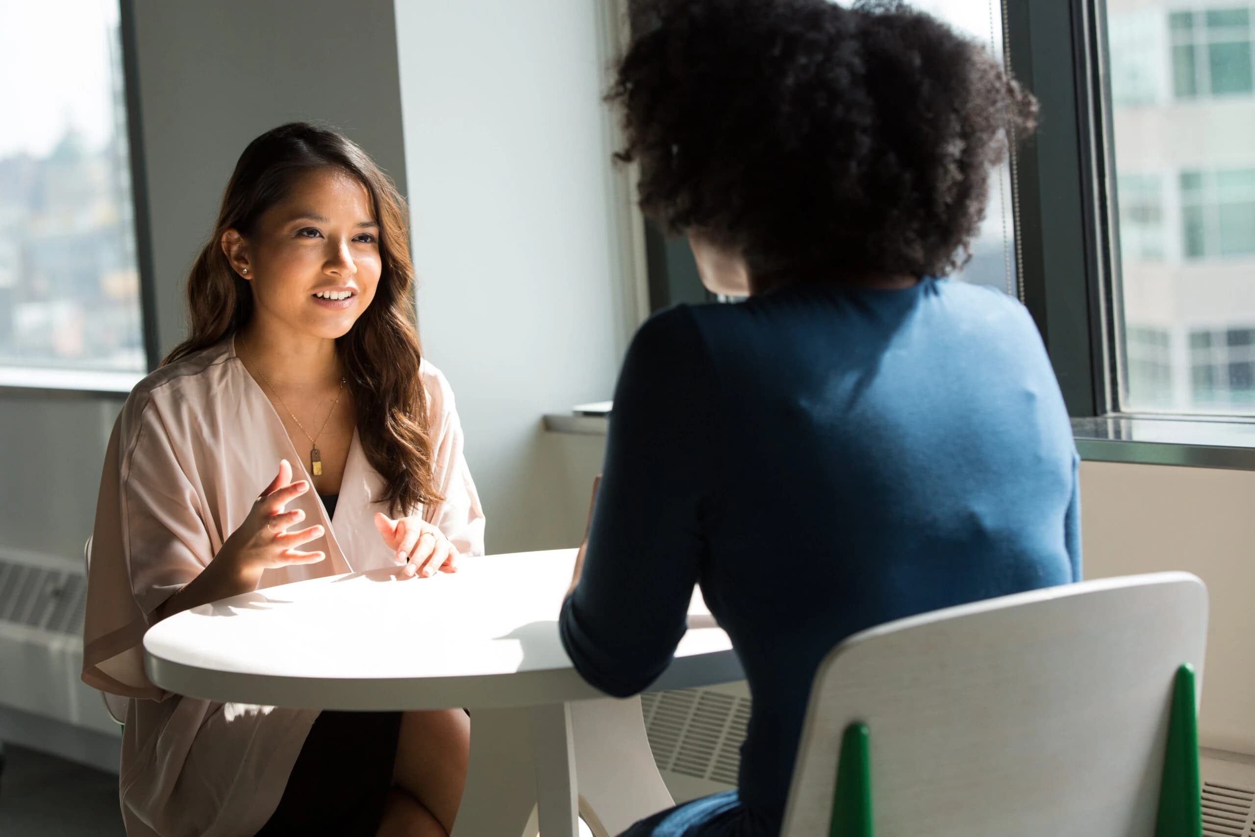 woman talks to therapist